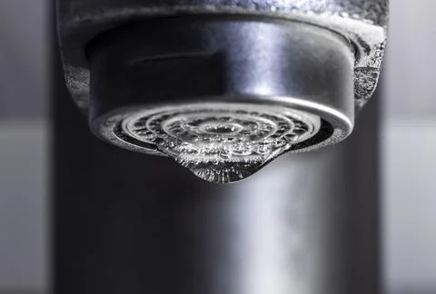 A drop of water on the tap Stock Photos