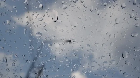 Drop of water on window glass, cloud and blue sky background Stock Footage 108773208