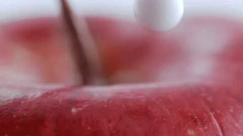Drop of White Cream on Apple Stock Footage 219464357