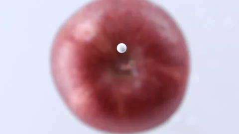Drop of white cream falling on apple Stock Footage 219464566