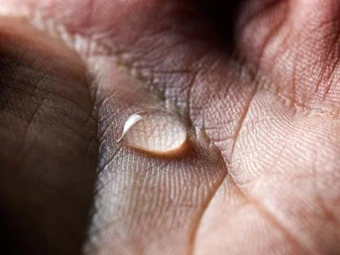 Drop in your palm Stock Photos
