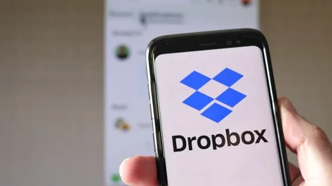 Dropbox Cloud Storage on a Smartphone app and Computer Screen Stock Footage 152117078
