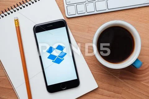 Dropbox is a free sharing pics, videos and documents app Stock Photos