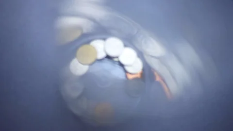 Droping coin in the plastic bottle Stock Footage 94017771