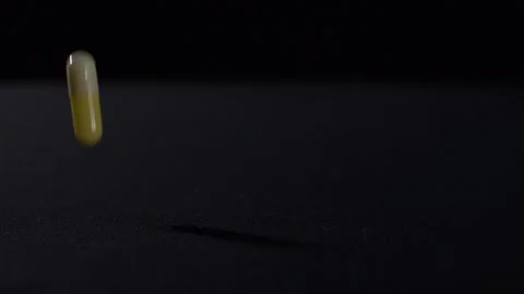 Droping pills slow motion 2 Stock Footage 131851122