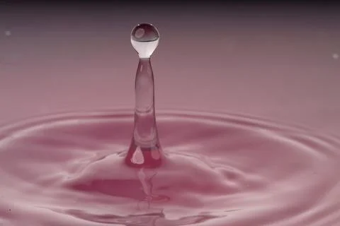Droplet collision Stock Photos