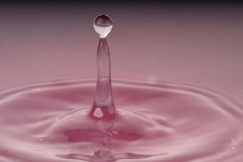 Droplet collision Stock Photos