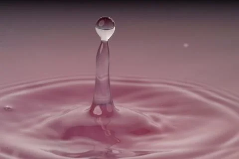 Droplet collision Stock Photos
