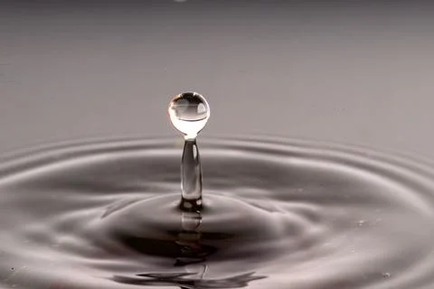 Droplet collision Stock Photos