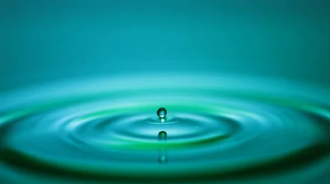 Droplet falling into water Stock Footage 8992447