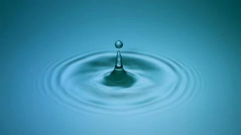 Droplet falling into water Stock Footage