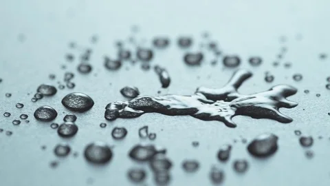 Droplet hits black Surface 01 Stock Footage 84076041