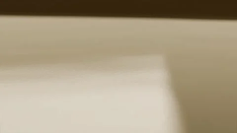 Droplet hitting tan surface creating bouncing drops and ripples at tray, 動画素材 339722011