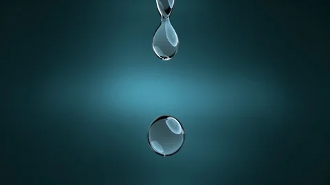 Droplet of pure blue liquid falling. Slow Motion drops. Stock Footage