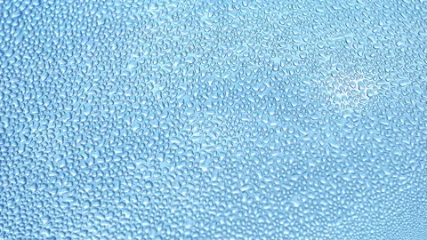Droplet rolls in a misted water bottle, a close-up of the drops, the texture of Stock Footage 132667115
