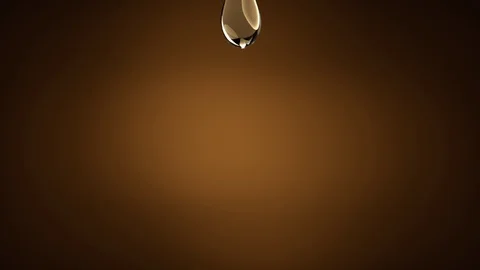 Droplets of oil falling. Slow Motion. Stock Footage 86825169