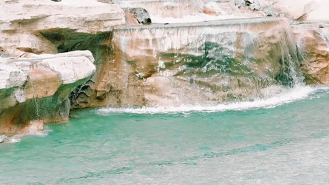 Droplets of Pool Water Flowing Between the Marbles Stock Footage 322072195