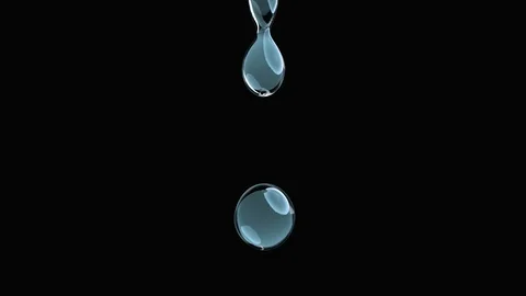 Droplets of pure liquid falling. Slow Motion. Isolated with alpha matte Stock Footage 86573877