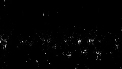 Droplets of rain falling on the surface creating splashes on background Stock Footage 126145772