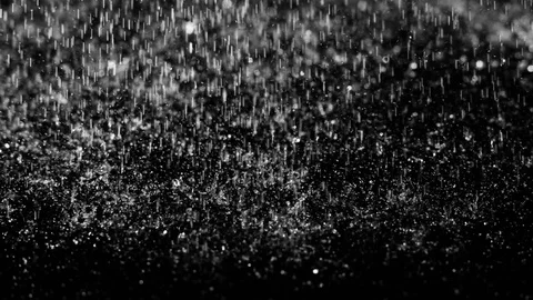 Droplets of rain falling on the surface on an isolated background Stock Footage 126140974