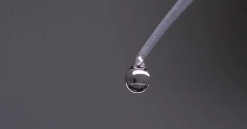 Droplets of Water Fall from Pipette Macro Stock Footage 73078315