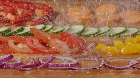 Droplets of water falling down on vegetables in slow motion 動画素材 89341711