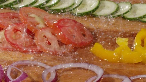 Droplets of water falling down on vegetables in slow motion 動画素材 89341936