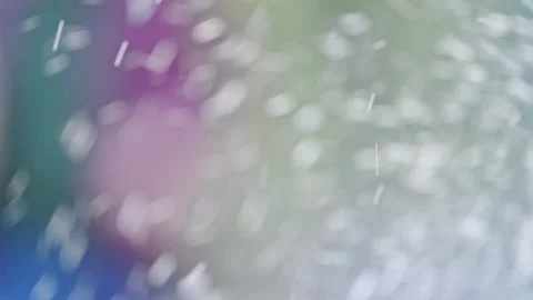 Droplets of water gracefully falling over a vibrant, nature-themed abstract Stock Footage 293741935
