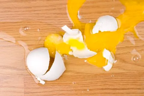 Dropped broken egg Stock Photos