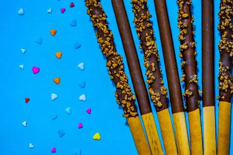 Dropped in chocolate a stick cookie Pepero. November 11th is Pepero Day in Korea Fotos de archivo