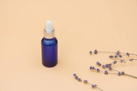 Dropper bottle on beige background Stock Photos