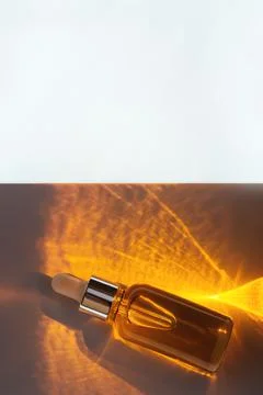 Dropper bottle on bright background Stock Photos