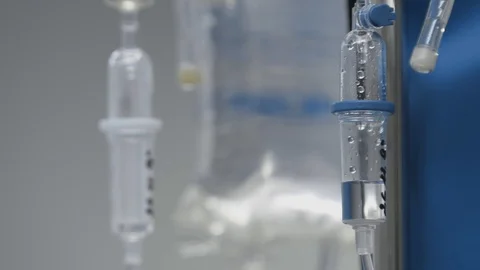 Dropper close-up with dripping medicine in operating room of modern hospital Stock Footage 102221504