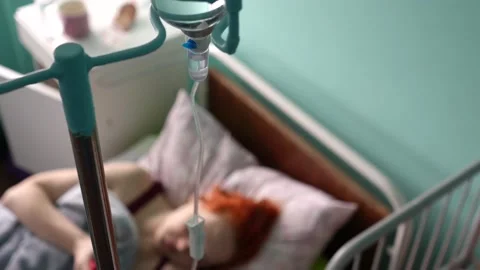 Dropper close-up. Top view of a blurred patient on the bed. Stock Footage 235597079