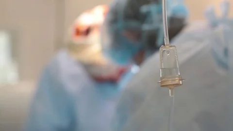 Dropper in the foreground. in the background in the blur operation Stock Footage 70807497