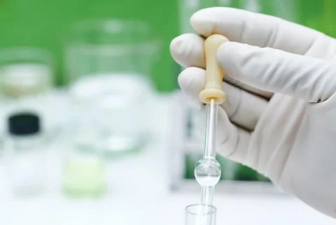 Dropper holding by hand Stock Photos