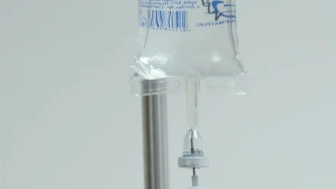 A dropper on a rack is suspended Stockbeeldmateriaal 123176482