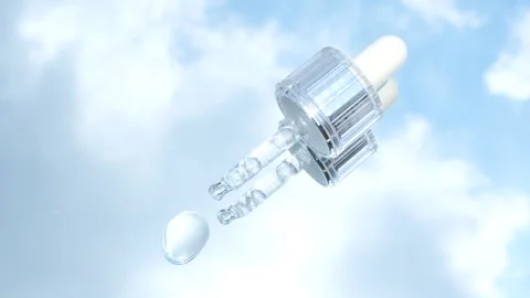 Dropper with serum on the mirror reflected in blue sky. Stock Footage 278145422