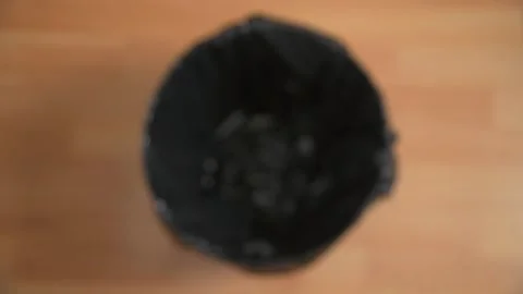 Dropping Black Fabric Mask In Bin Stock Footage 157173770
