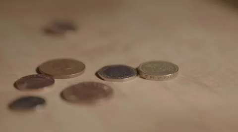 Dropping British coins, slow motion Stock Footage 56776024