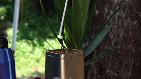 Dropping cable ties in to a tin Stock Footage 124982046