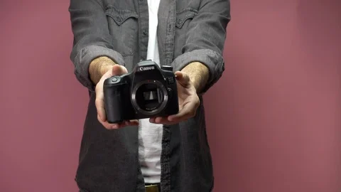 Dropping a camera in slow motion, breaking camera technology Stock Footage 124821359