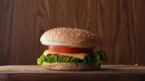 Dropping cheese burger from top Stock Footage 160567748