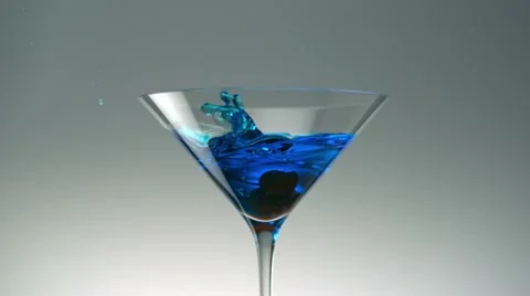 Dropping cherry into cocktail, Slow Motion Stock Footage 12692797
