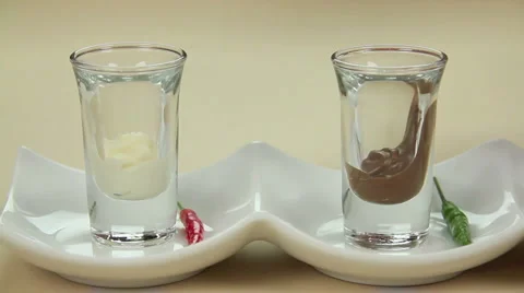 Dropping Chillies Into Choc 스톡 동영상 1085981