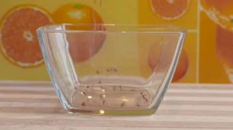 Dropping Chocolate Chips into a Bowl Stock Footage 58682525