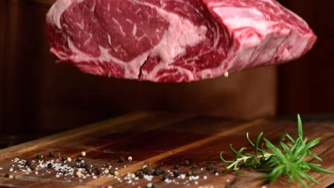 Dropping chunk of meat on cutting board Stock Footage 263764238