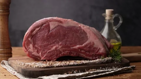 Dropping chunk of ribeye beef on spice, 240p Stock-Footage 157991682
