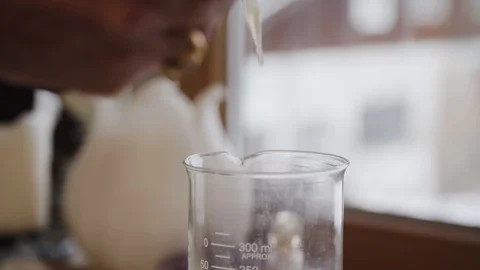 Dropping Clear Transparent Liquid with Pipette into Container Stock Footage 111757149