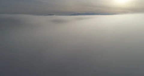 Dropping into the clouds during a flight Stock Footage 161812284